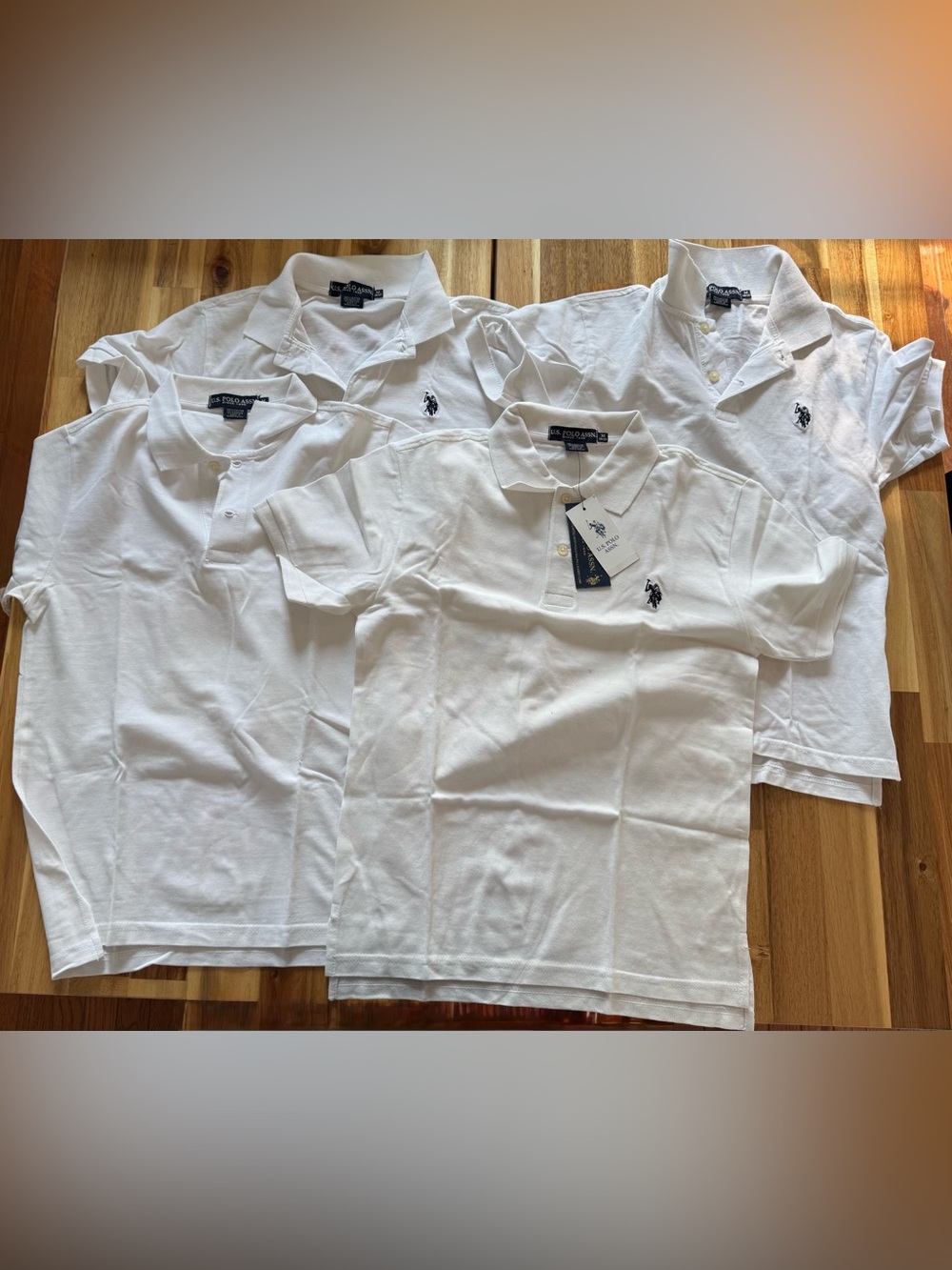 Bundle of four boys U.S. Polo shirts (M 10-12)
